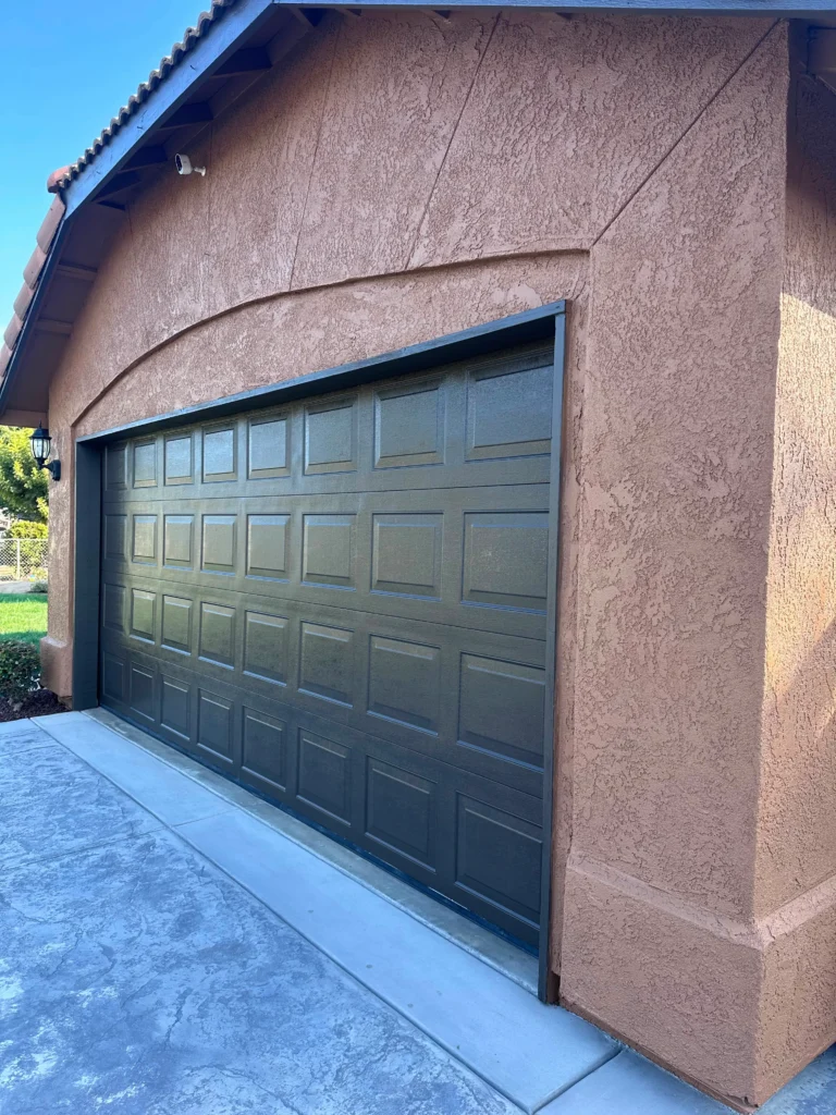 Exterior house painting with garage door in Visalia, CA